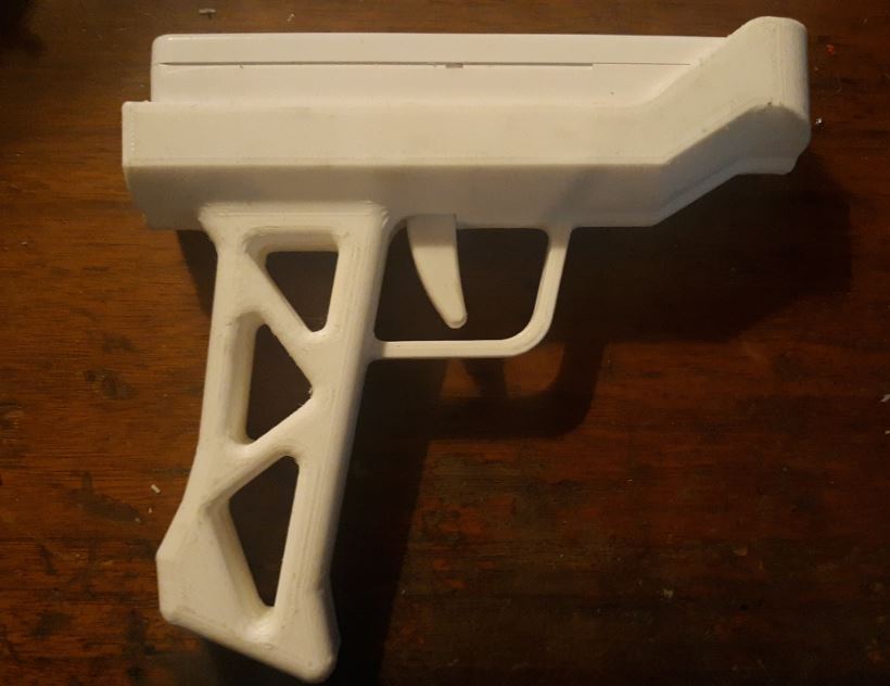 Wiimote Gun with captive pen spring trigger assembly