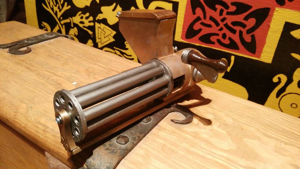 Small rotating, shell ejecting gatling gun