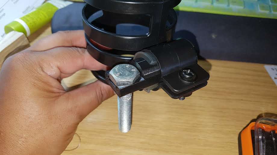 Adapter to secure a cup holder to a wheelchair.
