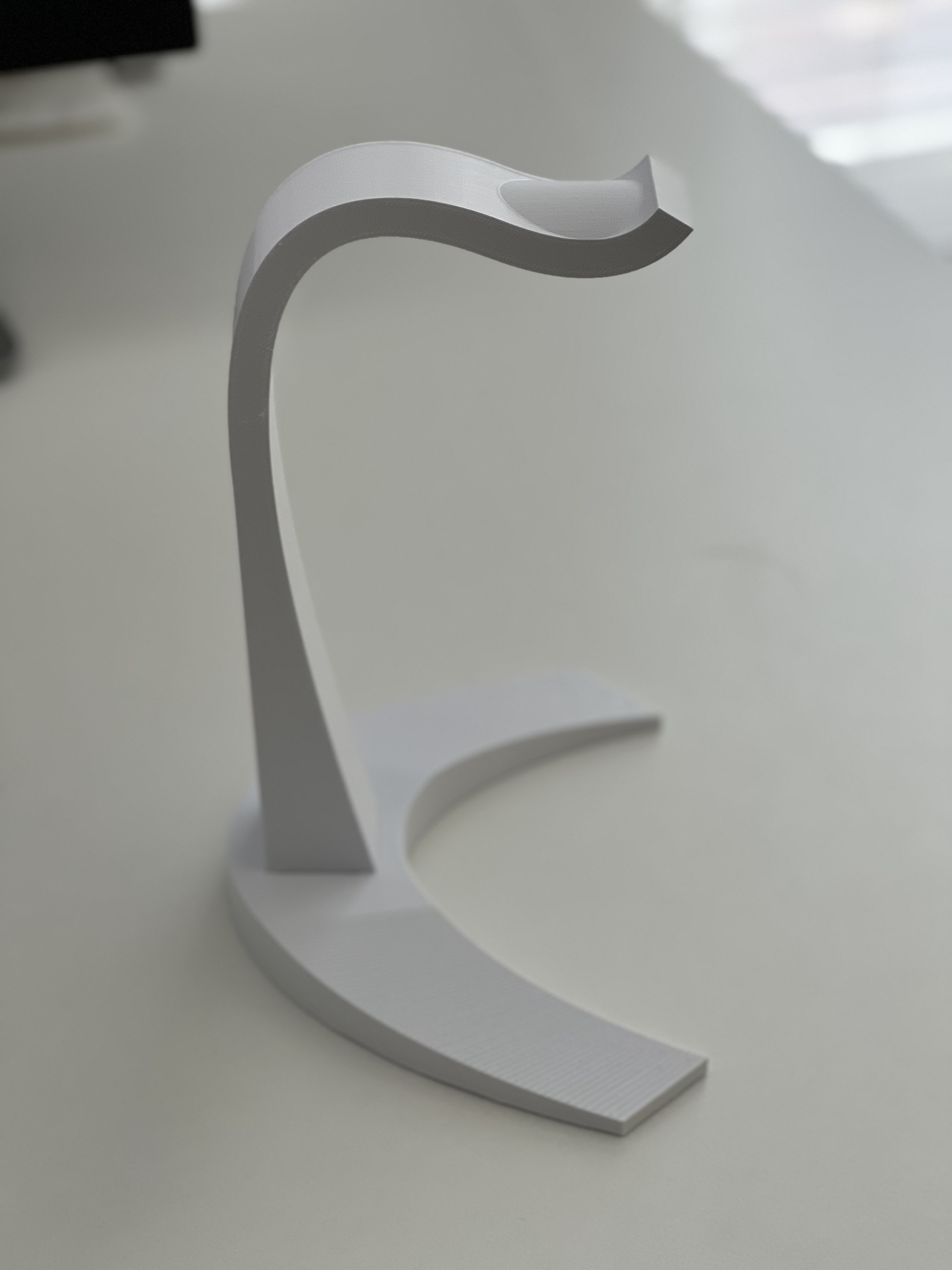 Yet another headphone stand, with added curve