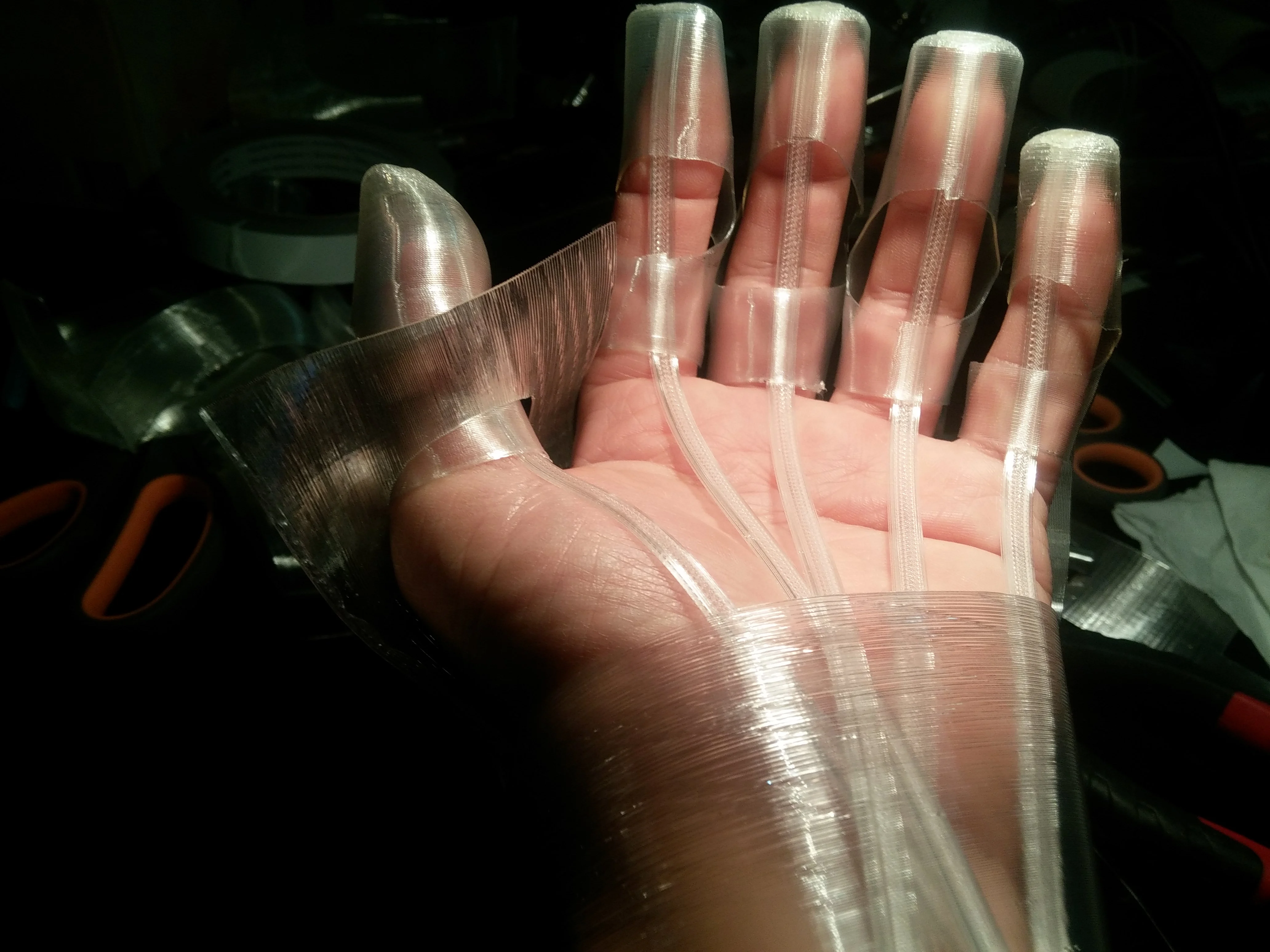 SMA or motor powered exoskeleton hand