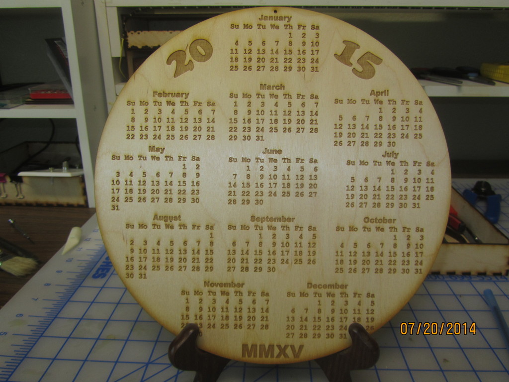 Laser Engraved Calendar.  Laser burned and cut 2015 circle calendar on wood.