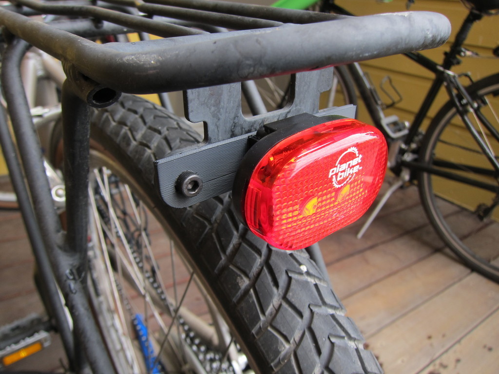 Bike light to rack adapter plate