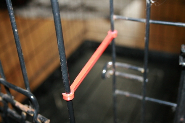 Pet cage door stay