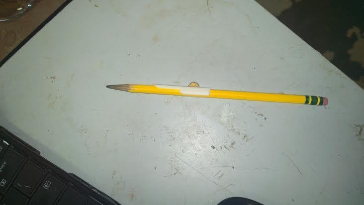 David Copperfield magic trick. Pencil through dollar