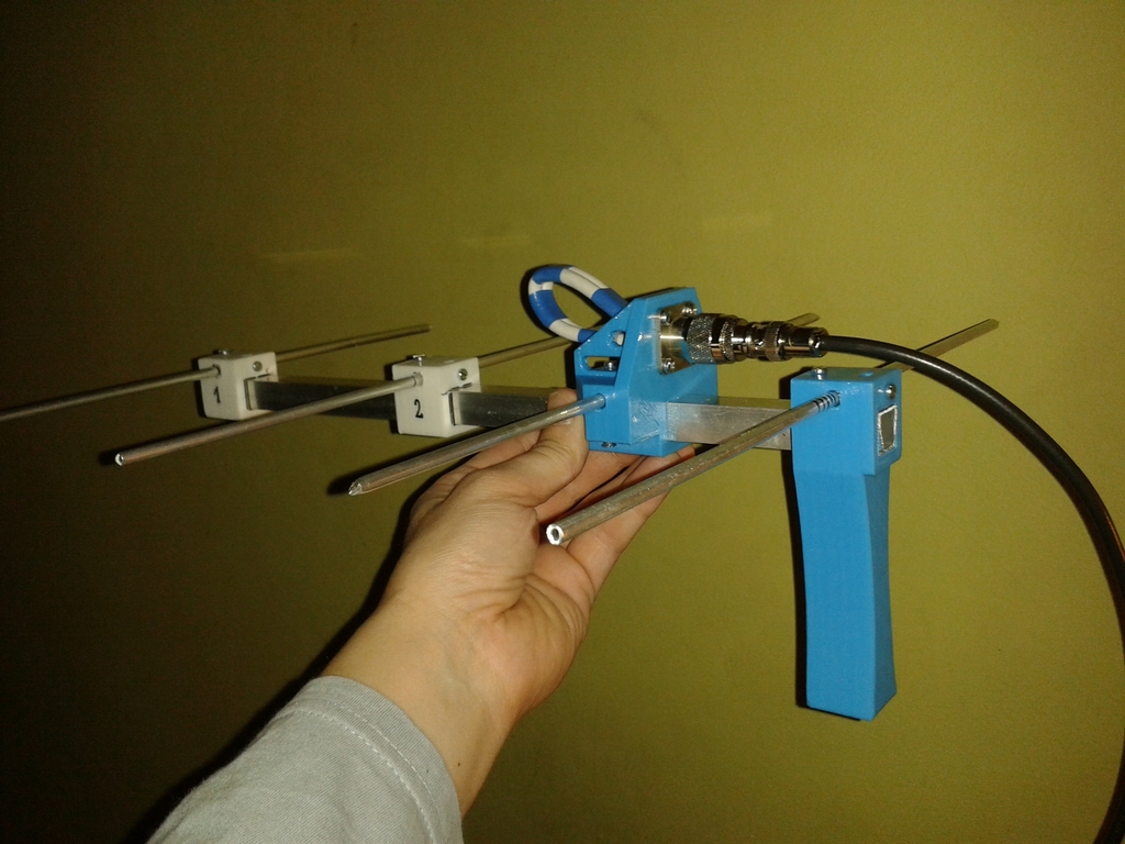 Yagi-Uda antenna director holder with grip