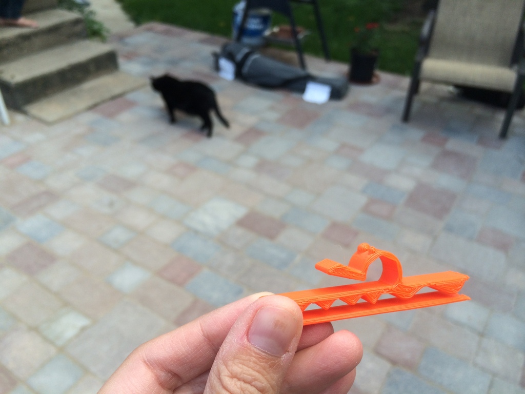 Daypack hydration tube clip