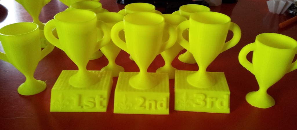 1st, 2nd, and 3rd place trophies with Fleur de Lis