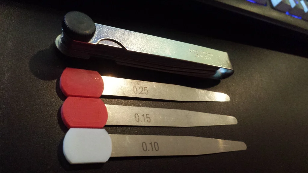 Feeler gauge tab/grip
