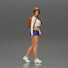 sexy girl walking in shorts and mini short and backpack