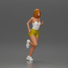 Woman with short hair wearing white top and yellow shorts running