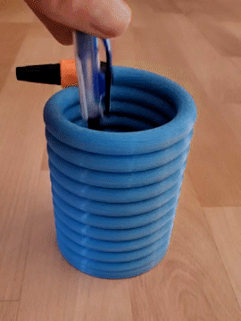 Water hose as pen holder in spiral shape