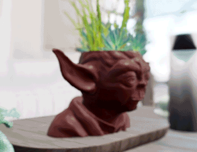 "Bring Home the Adorable: Grogu Planter Pot - Your Galaxy's Cutest Indoor Garden Companion!"