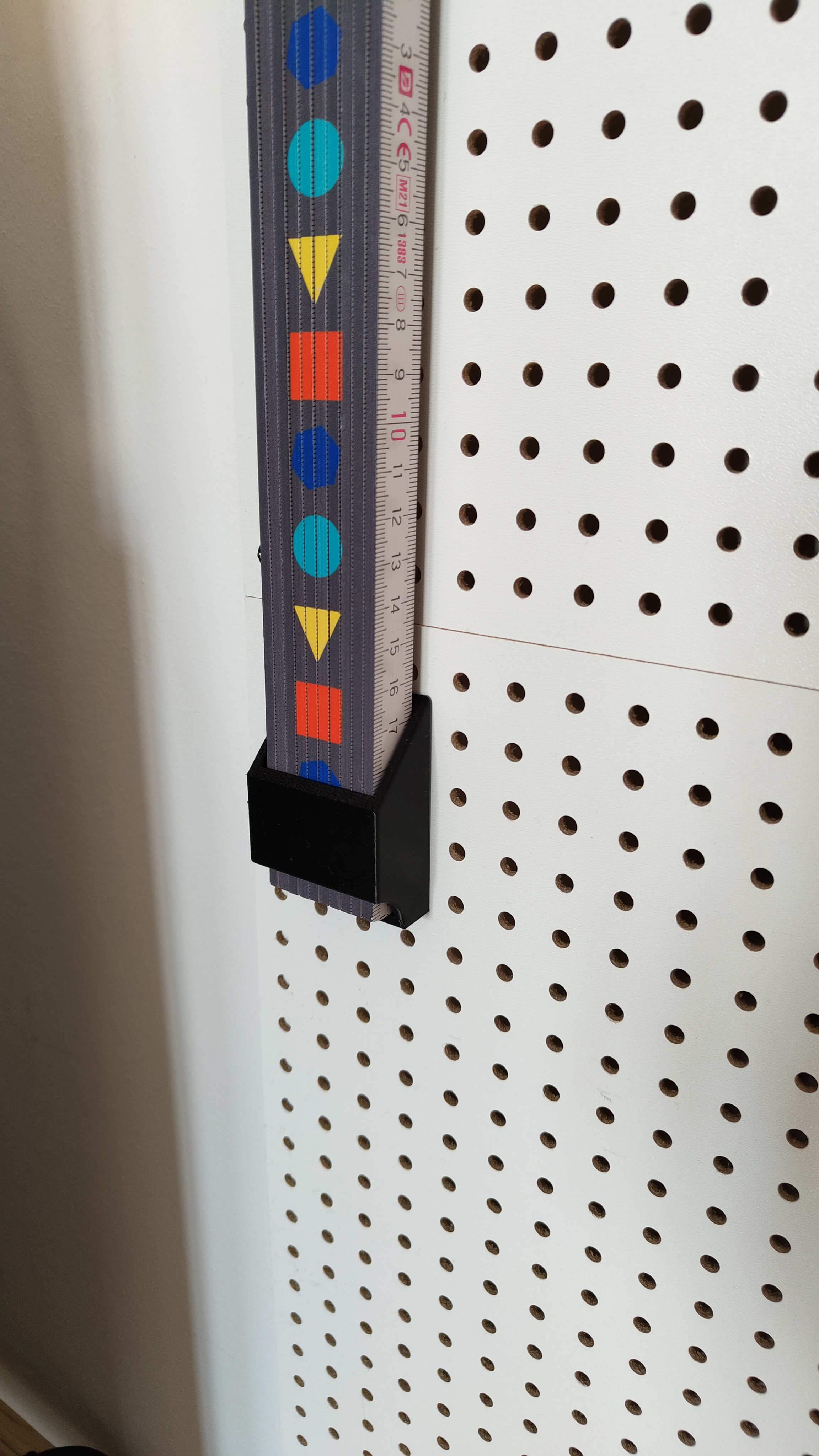 Folding Ruler Holder for Metric Pegboards