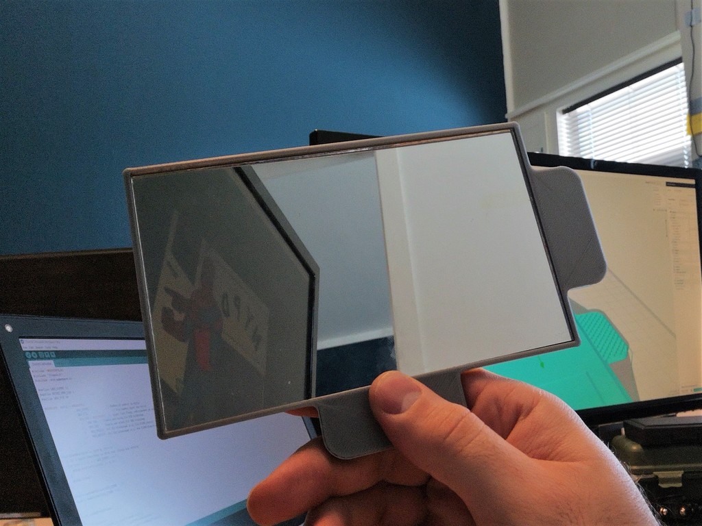 Mirror bezel/handle