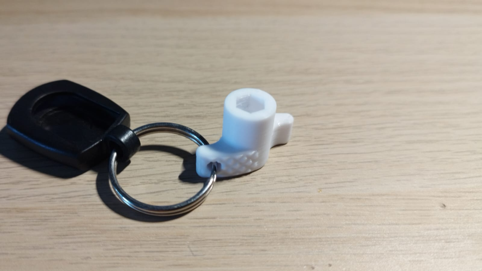 Bit driver with relief cutouts and keyring hole