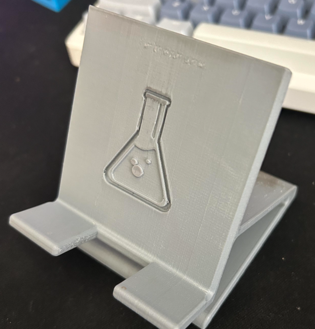 Phone Stand with Flask on it