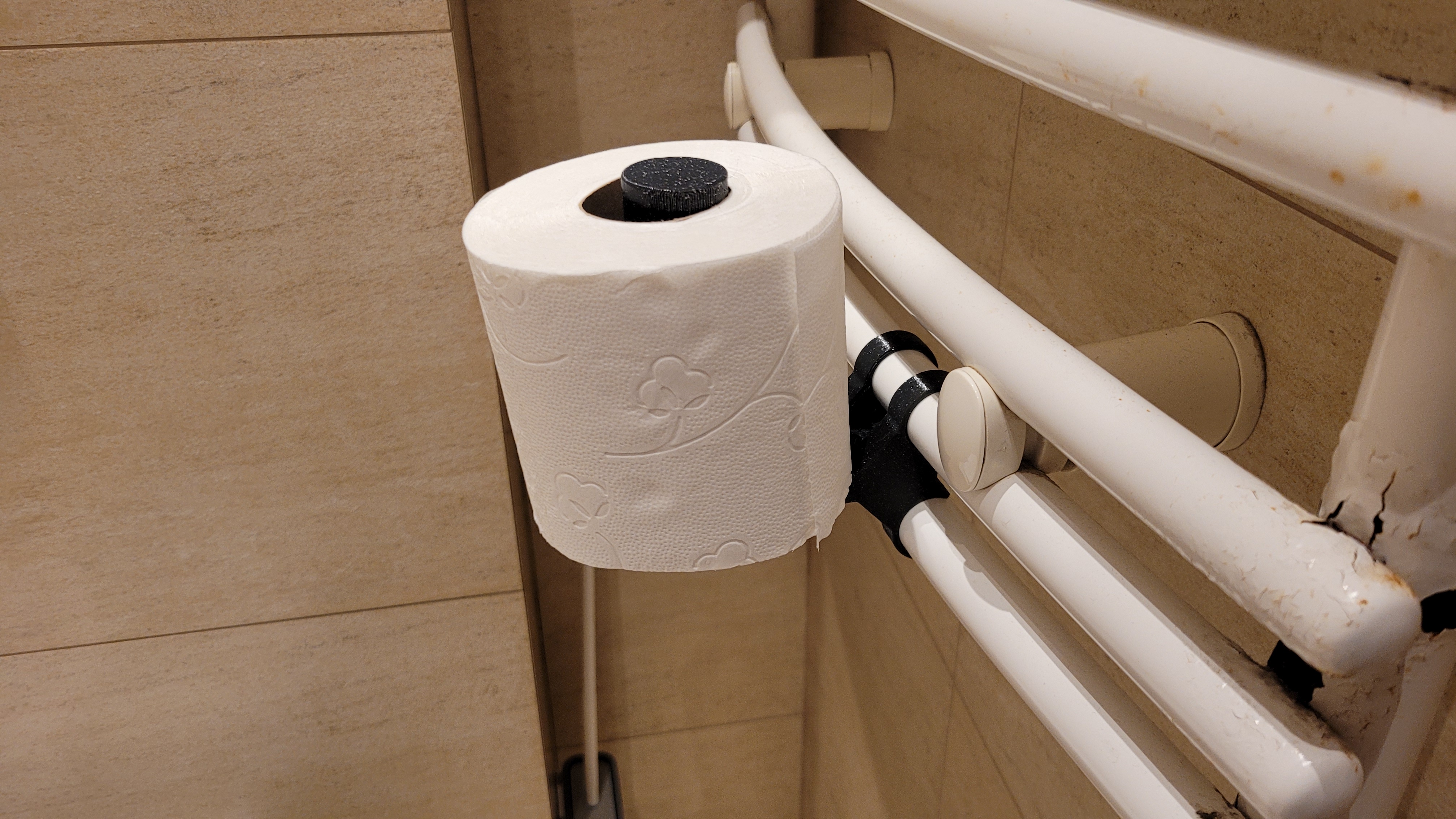 Bathroom radiator toilet paper holder