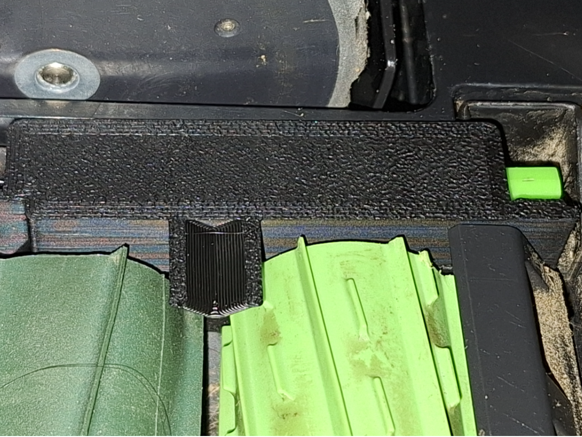 Roomba brush latch