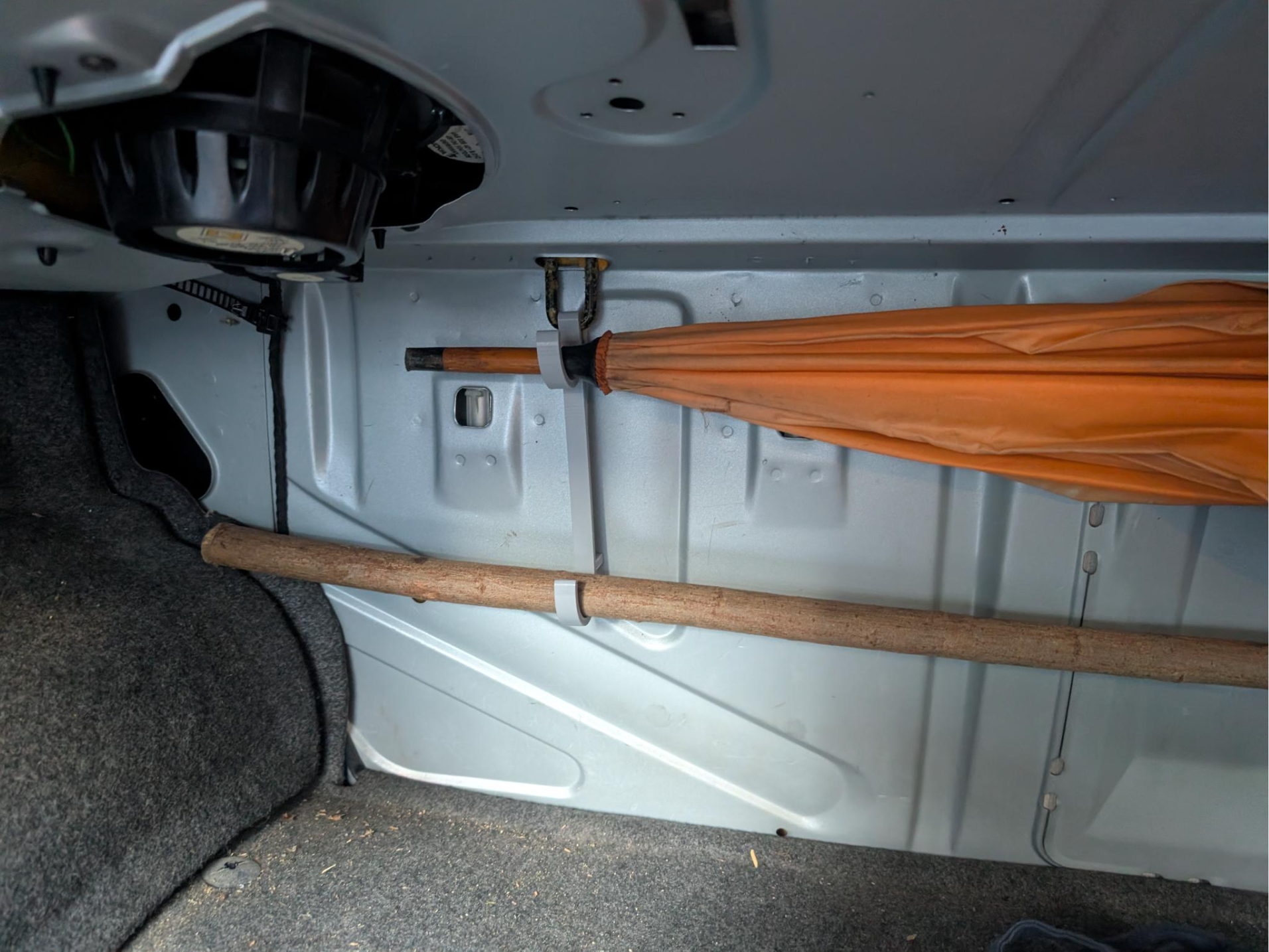 Umbrella/fishing rod holder for car trunk hooks