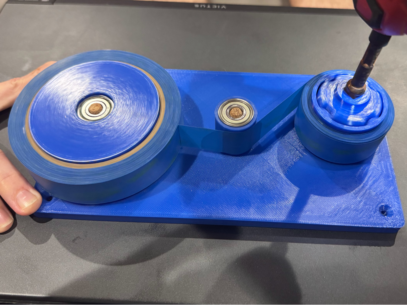 Spooler for 1 inch wide painter's tape rolls
