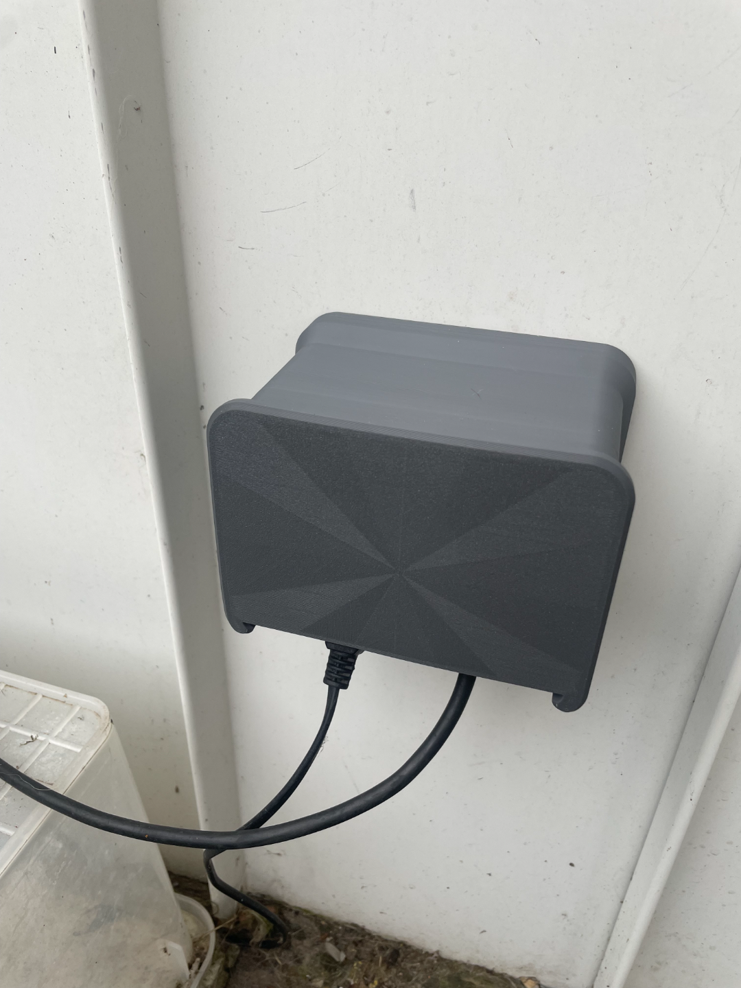 Weather shield for outside power outlet