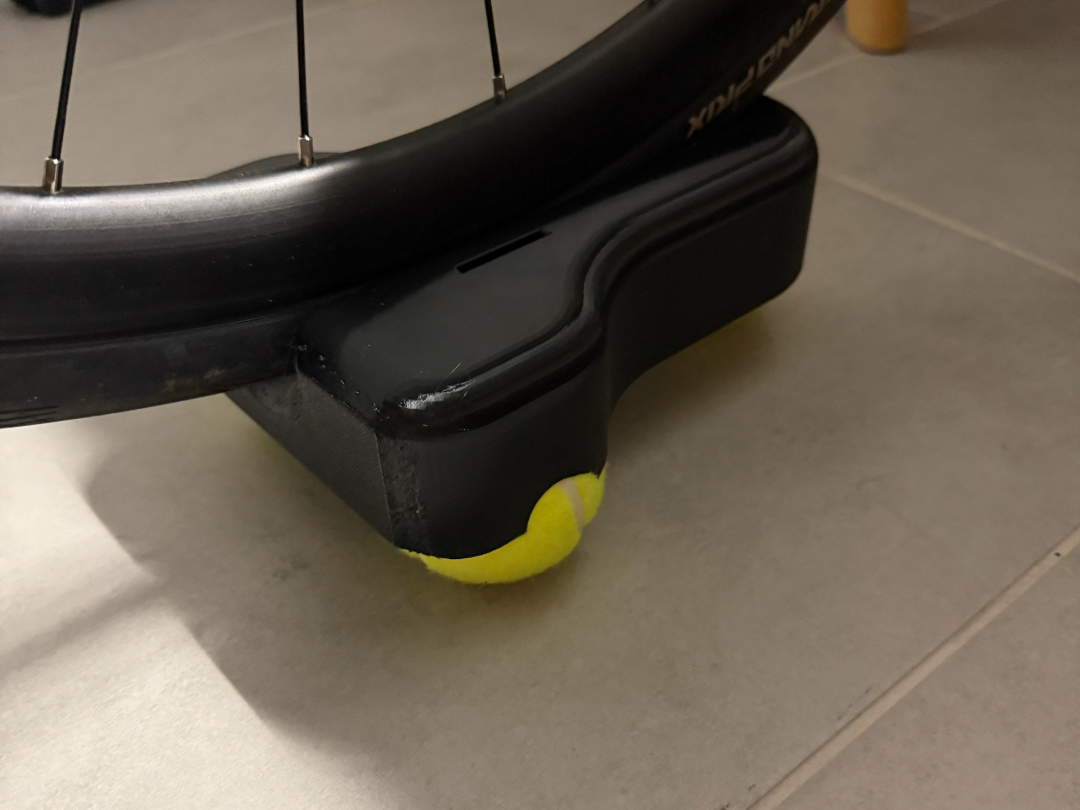 Front wheel raiser for indoor smart trainer