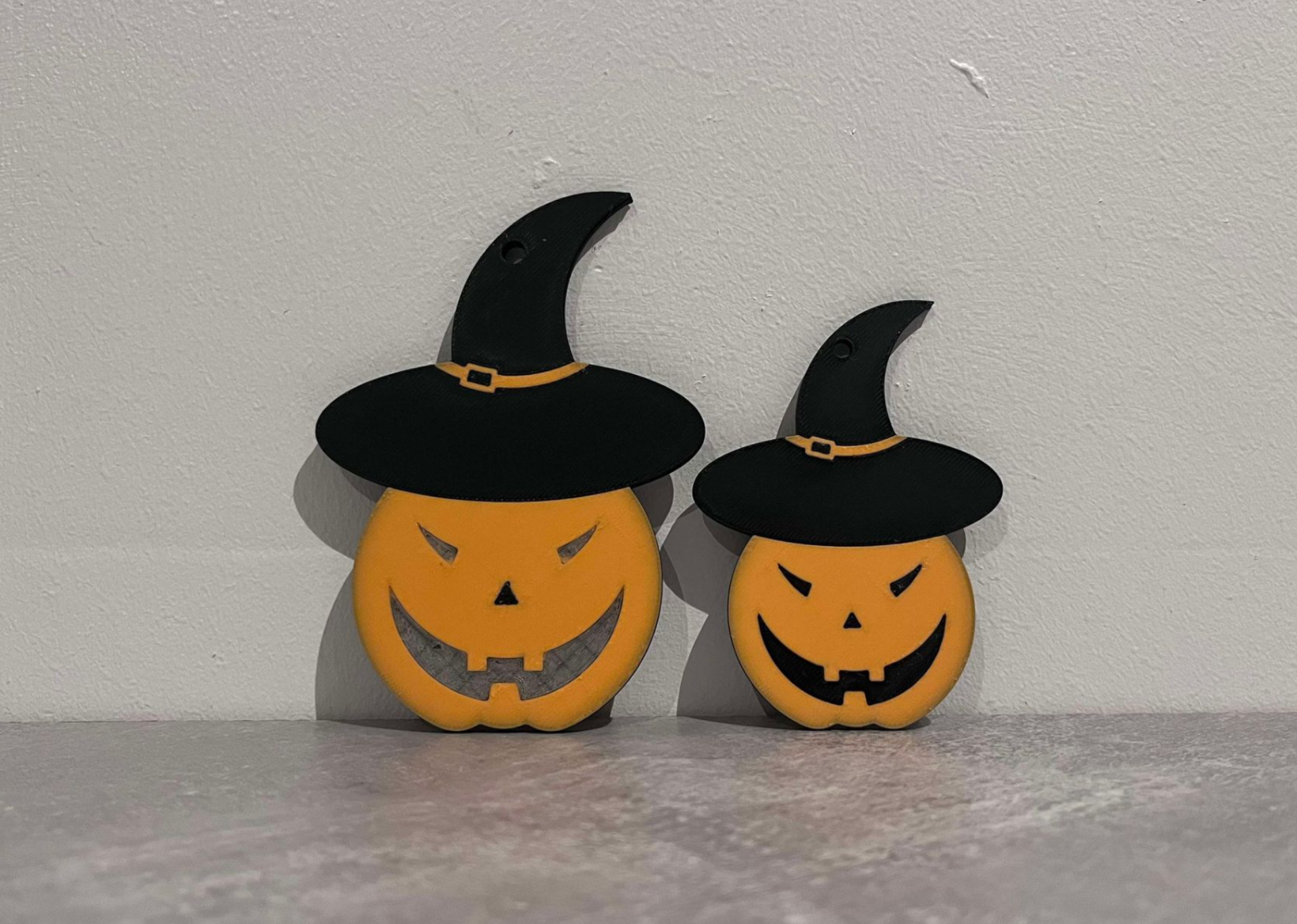 Halloween pumpkin with hat and evil eyes.