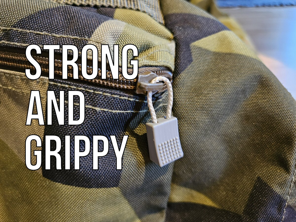 Zipper pull tab