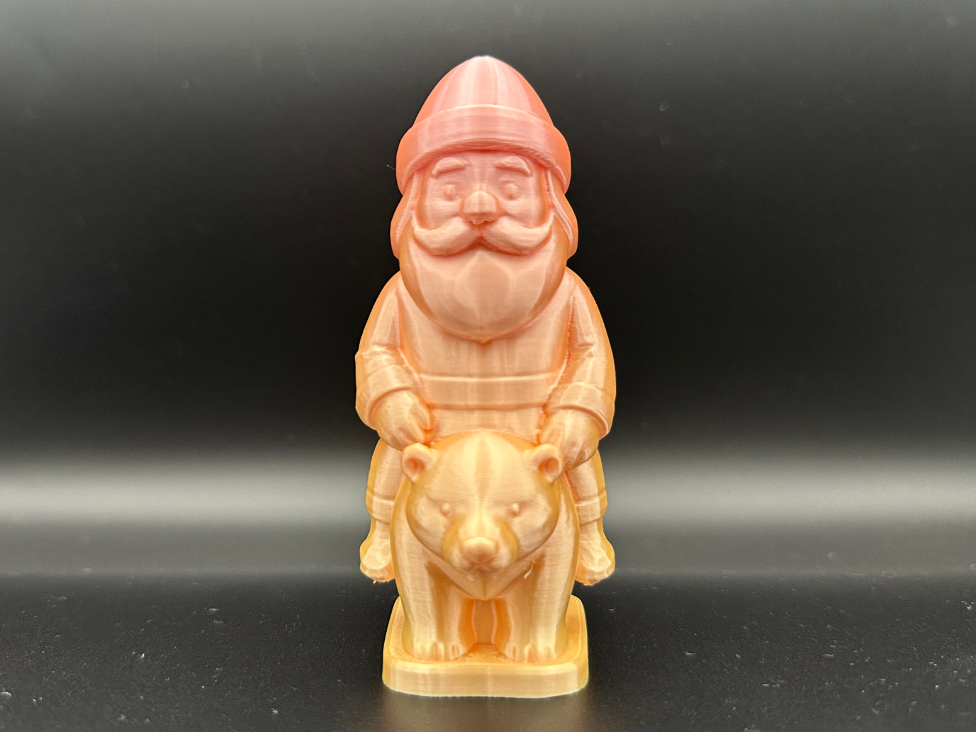 Carved Santa on a Bear Figurine