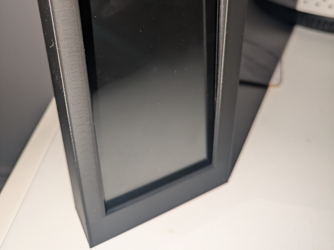 Wall phone holder - for use with command strips