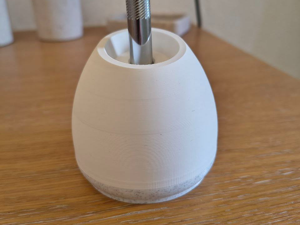 Razor holder egg-shaped, used blade container