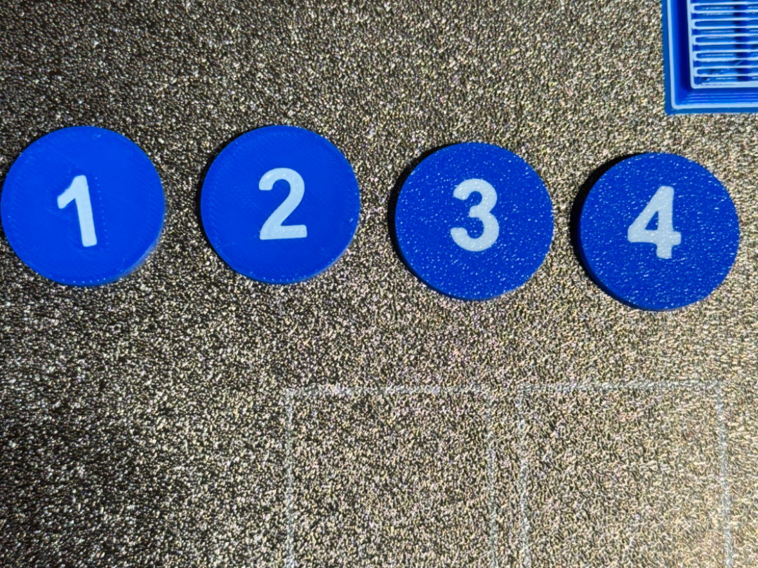 flush text and deboss text coin tests