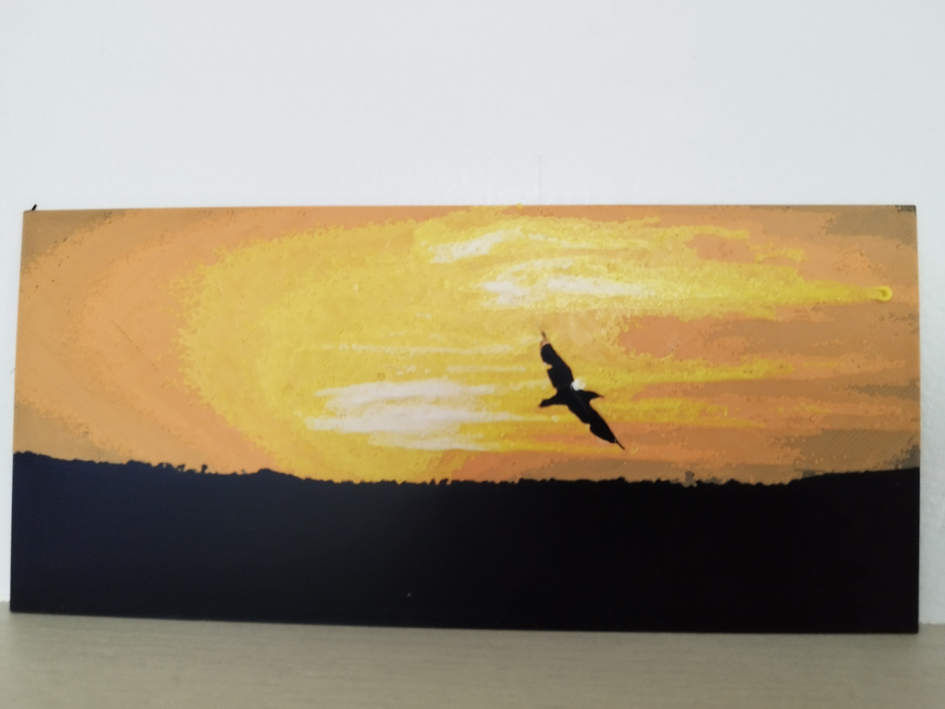 Bird flyng in sunset