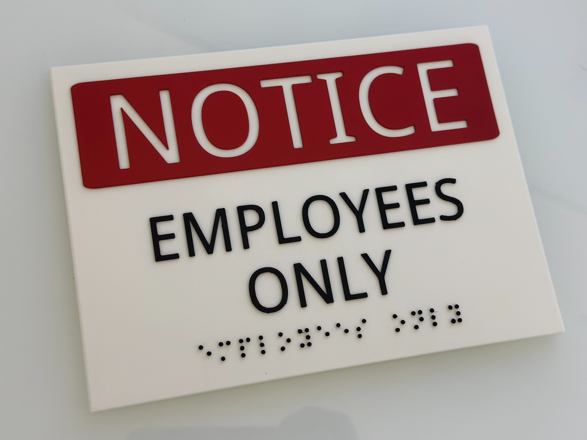 Employees Only Sign with Braille