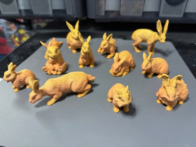Twelve miniature rabbits / hares on a plate