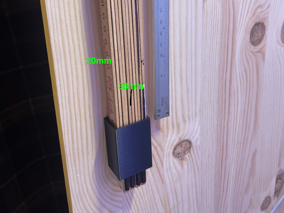 Folding rule wall holder