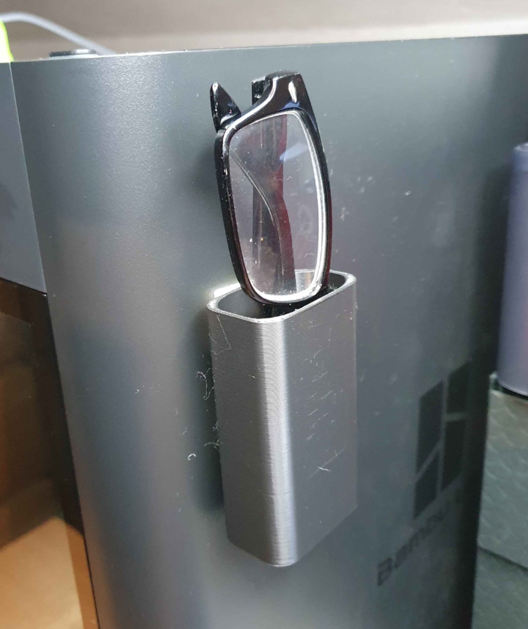 Stick on reading glasses holder