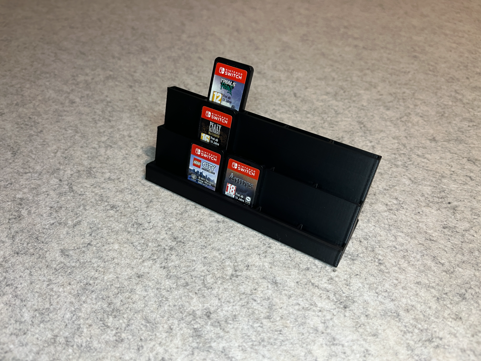 Display stand holder for Nintendo Switch games