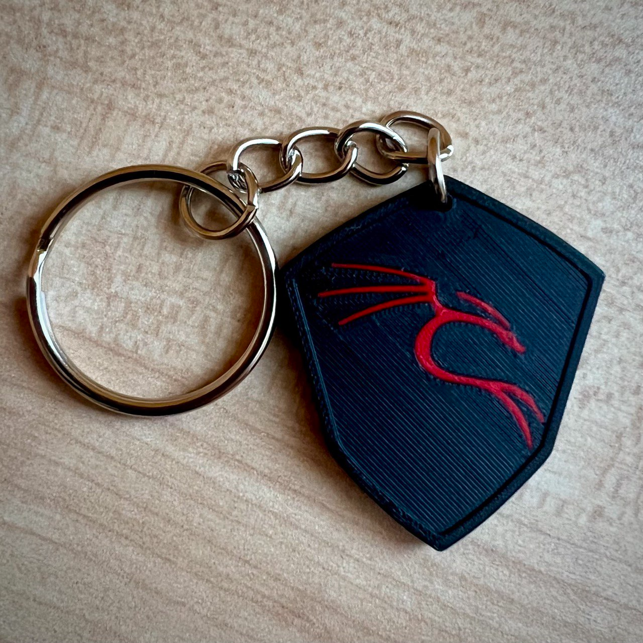 Kali Linux distro logo key chain.