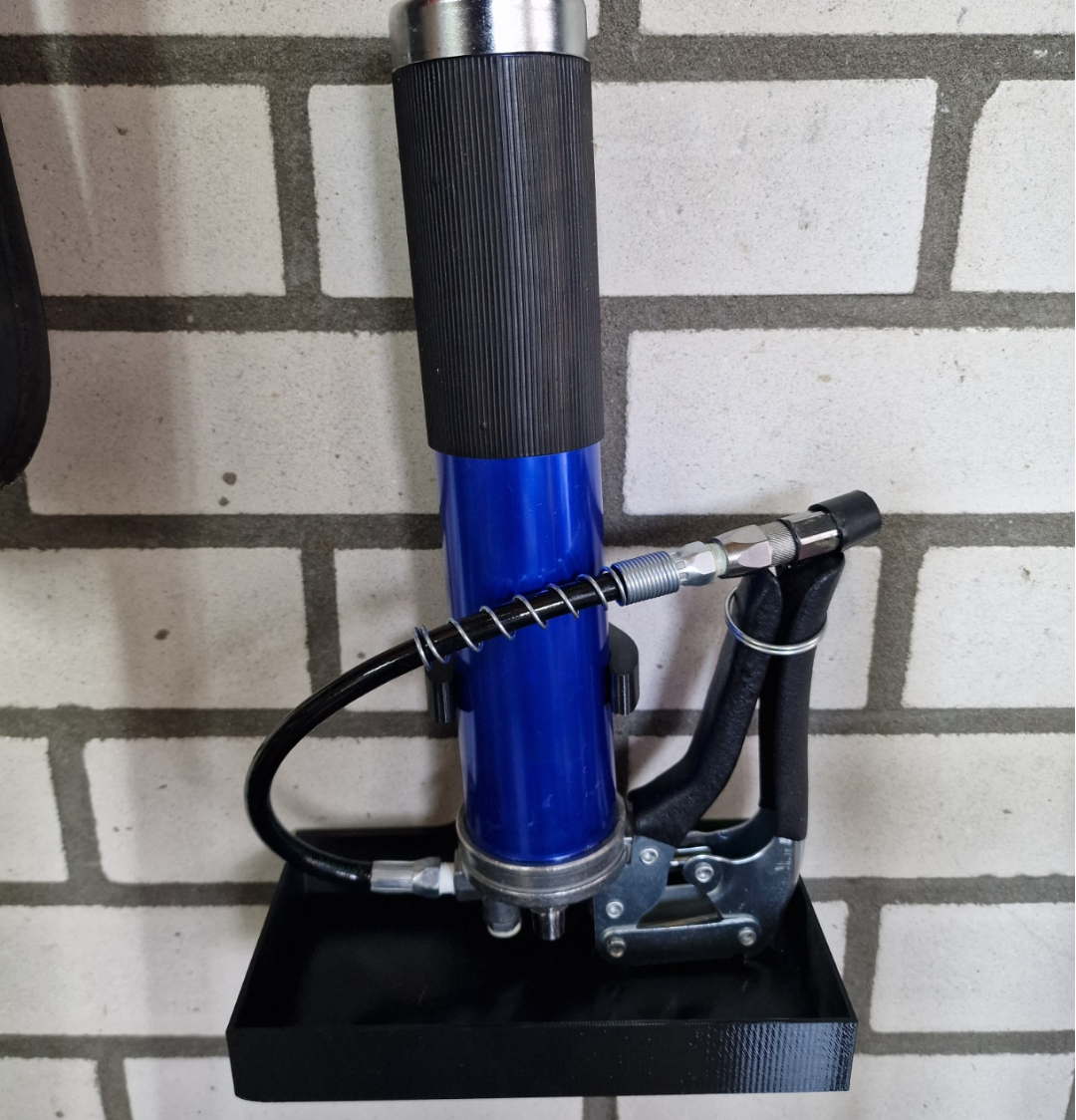 Grease gun holder with anti-leaking basket.