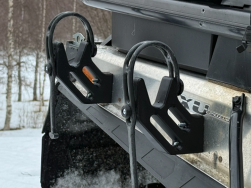 Snowmobile ice auger mount
