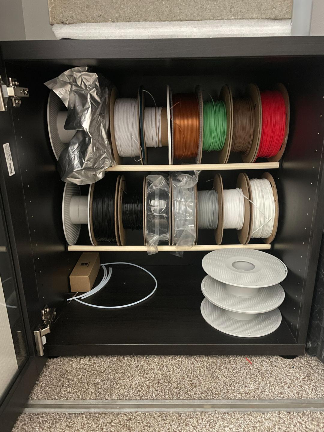 Spool holder brackets for the Ikea Besta cabinet.