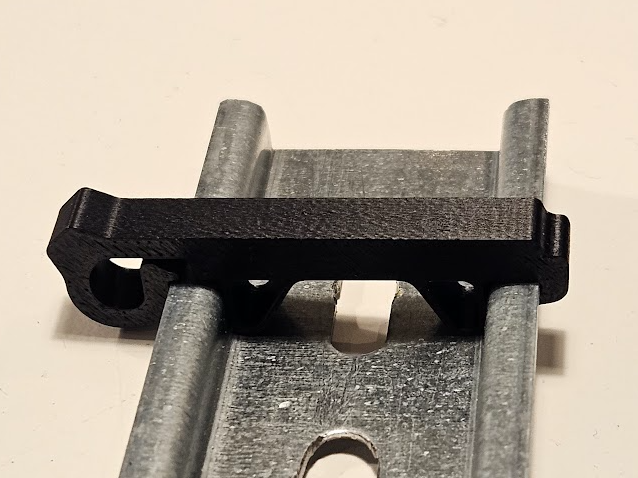 DIN rail stop, slim footprint