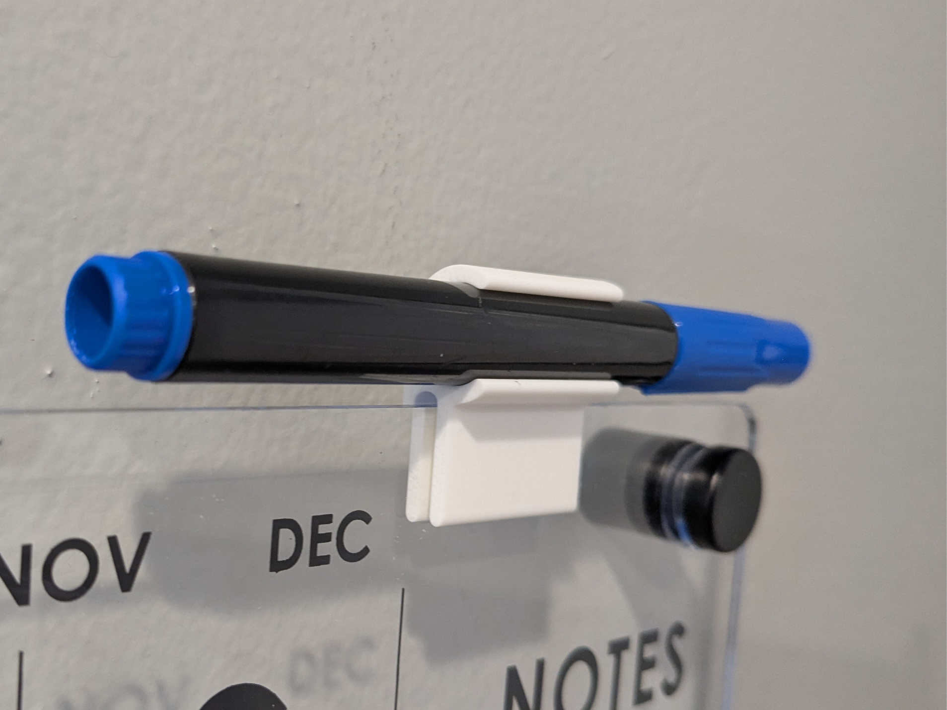Dry erase board marker holder
