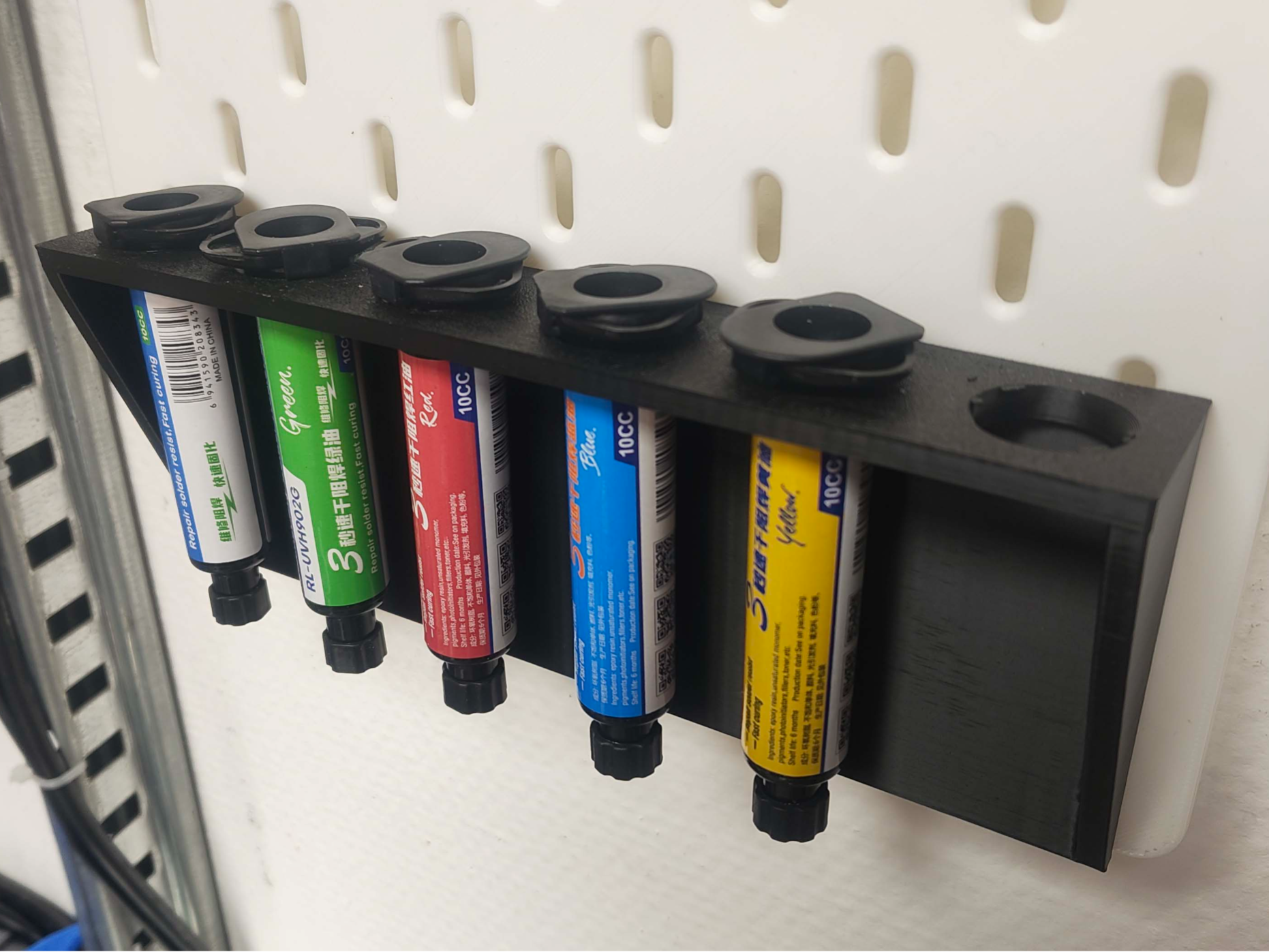 Skadis - syringe UV-solder mask holder