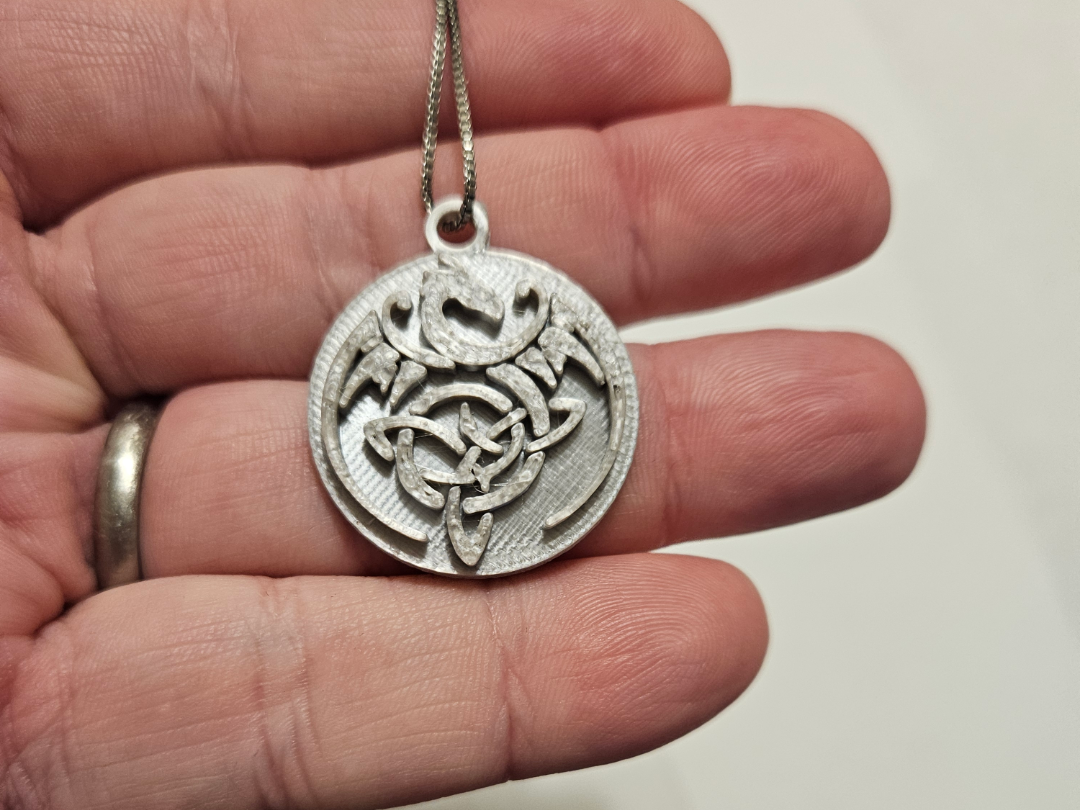 Celtic dragon symbol medallion