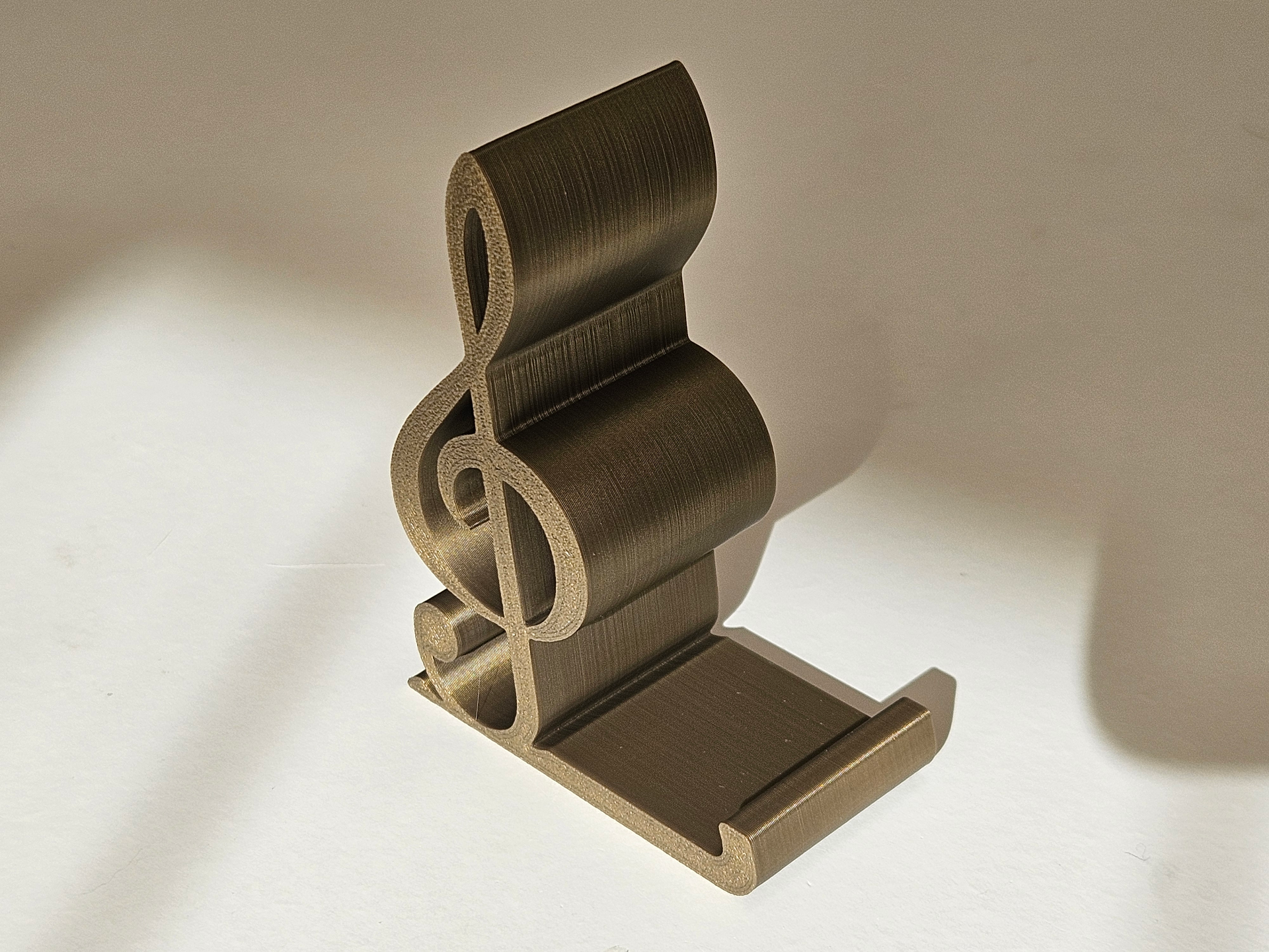 Treble clef phone stand holder