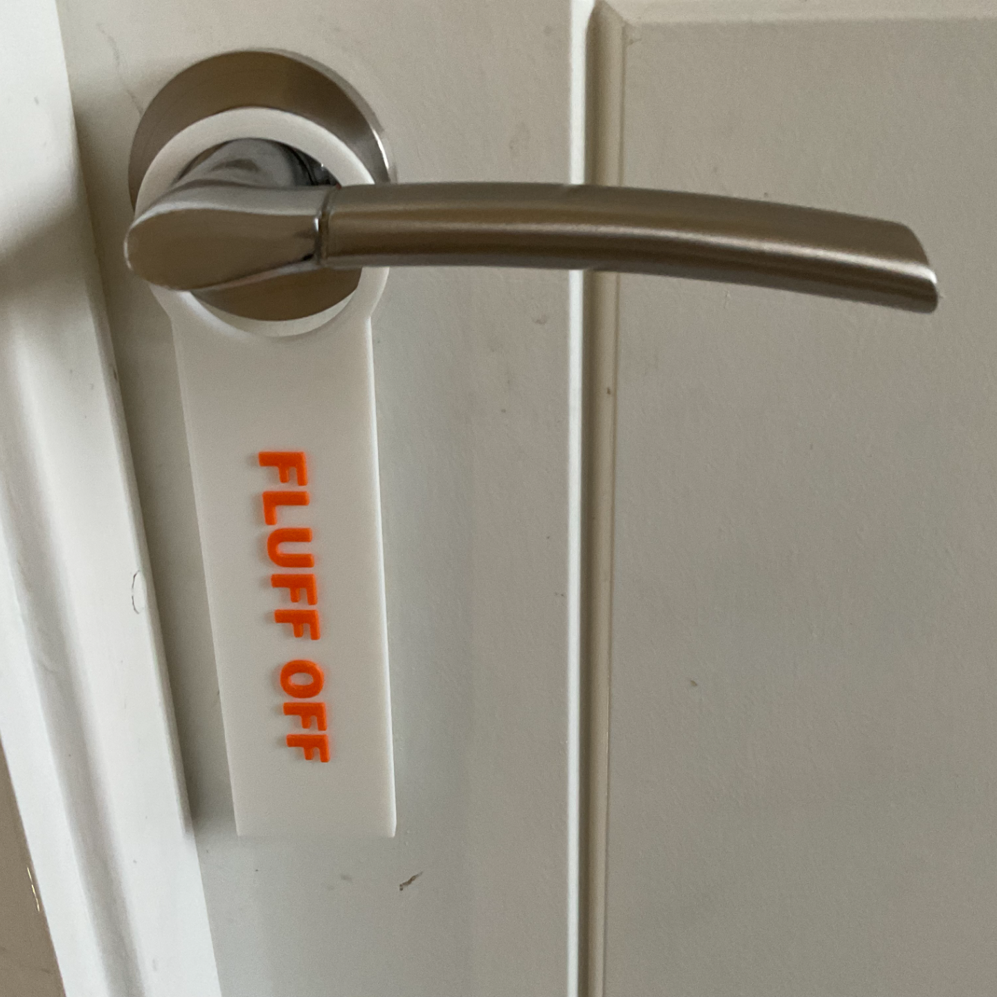 Fluff off door sign