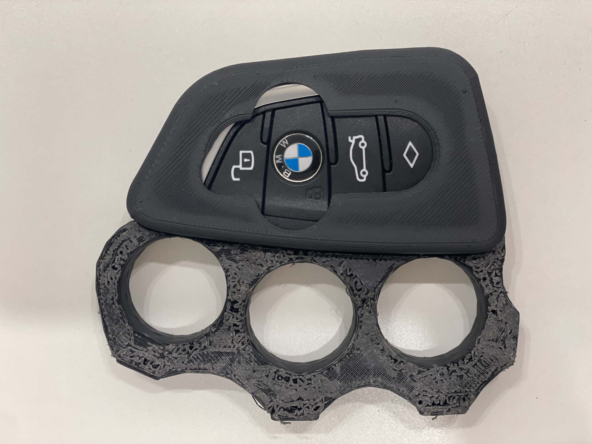 Constantine inspired knuckle for BMW key fob.